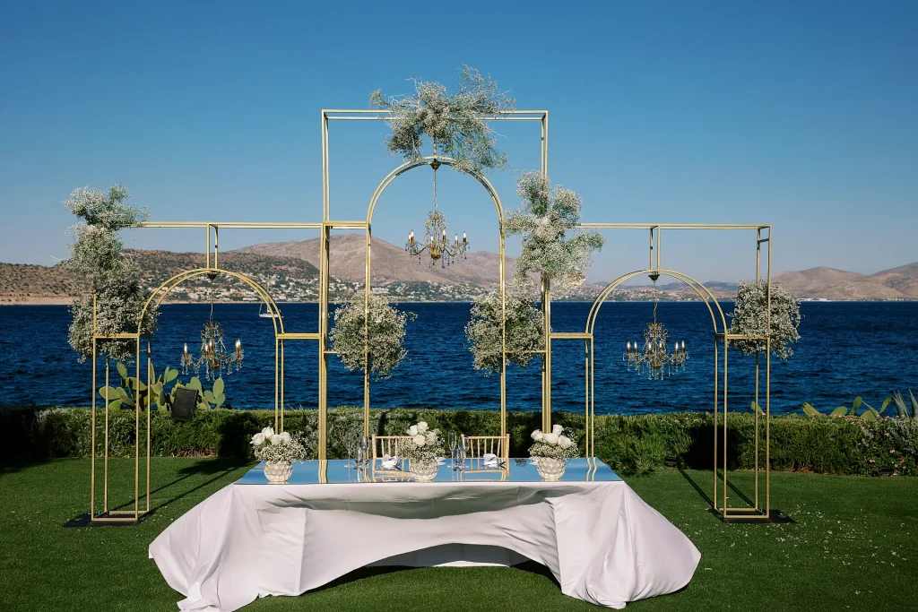 Luxury wedding lighting design with multiple chandeliers at Island Athens Riviera