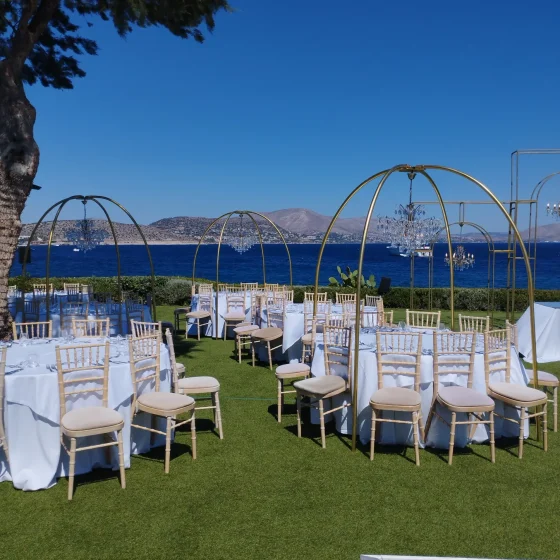 Luxury wedding lighting design with multiple chandeliers at Island Athens Riviera