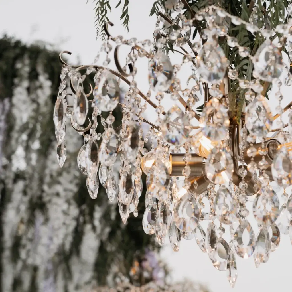 Elegant wedding reception dinner table lighting with hanging crystal chandeliers Athens